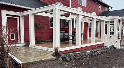 Custom trex deck and faux post beam pergola with recessed led lighting and step lighting